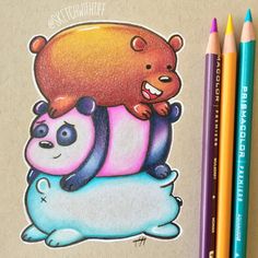 two colored pencils next to a drawing of a bear and panda on top of each other