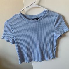 Never Worn But Doesnt Still Have A Tag, Light Baby-Blue Color, Cropped Trendy Blue Ribbed T-shirt, Fitted Blue Ribbed T-shirt, Trendy Light Wash Stretch Tops, Light Blue Fitted Ribbed Top, Blue Ribbed Crew Neck Top, Light Blue Stretch Crew Neck Top, Light Blue Ribbed Stretch Top, Light Blue Stretch Ribbed Top, Stretch Ribbed Light Blue Top