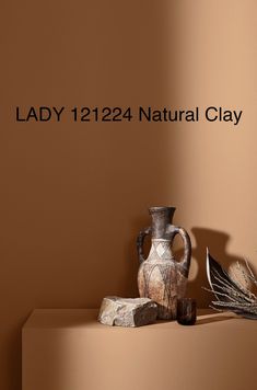 an image of a vase and other items on a shelf with the words lady 1224 natural clay