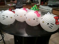 paper lanterns with hello kitty faces on them