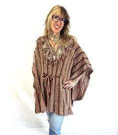 Great vintage condition.  One size fits all Knits with Appeal by Bananas - 80% acrylic, 20% mohair Union made - USA Ties at waist to fit 33" top to bottom Handmade Brown Bohemian Poncho, One Size Bohemian Alpaca Poncho, Brown Knitted Beach Sweater, Fall Festival Alpaca Poncho, Handmade Poncho For Fall Festival, Oversized Brown Bohemian Sweater, Handmade Fall Festival Poncho, Vintage One-size Winter Poncho, Vintage Winter Poncho One Size