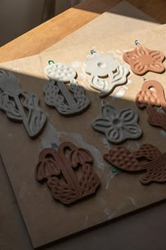 several cookie cutters sitting on top of a piece of paper next to each other