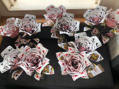 several playing cards are arranged in the shape of roses