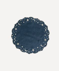 a blue paper plate with stars and moon designs on the edges, against a white background