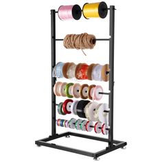 a rack with many spools of thread on it