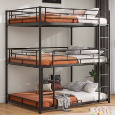 a bunk bed with two sets of mattresses on the bottom and one is orange