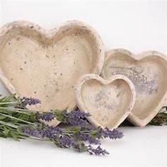 three heart shaped dishes with lavender sprigs in the foreground and one on the right