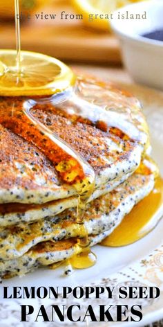 lemon poppy seed pancakes on a plate with syrup