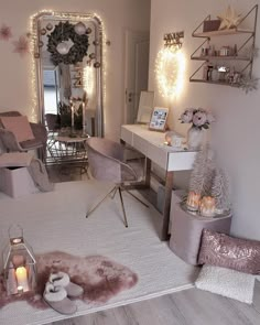 a bedroom decorated for christmas with lights on the wall and furniture in front of it