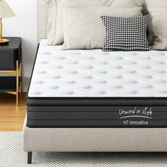 an unwrapped mattress on a bed in a bedroom