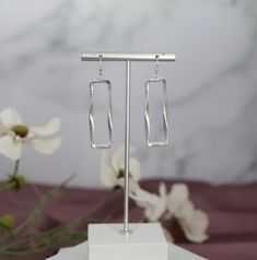 These earrings are so much fun to wear! They are made of silver and have a rectangle shape that dangles. They are the perfect accessory for any occasion. You can dress them up or dress them down. They are sure to add a bit of sparkle to your outfit. Trendy Silver Rectangular Earrings, Square Metal Earrings For Gifts, Square Metal Earrings For Gift, Trendy Square Earrings As Gift, Trendy Nail Art Designs, A Rectangle, Trendy Nail, Dangling Earrings, Your Outfit