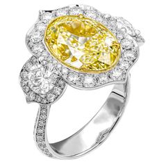 Aladdin Style 3 stone ring Crafted in Platinum & 18K Yellow Gold, Center: 6.02ct Natural Fancy Light Yellow Even VS1 Oval Shape Diamond GIA#5221505250 2 side round stones: 0.73ct & 0.70ct (Totaling 1.43ct) Diamond cathedral shank and fully encrusted diamond gallery totaling 0.91ct Size: 6.5 Fancy Light, Arabic Style, Heritage Jewellery, Yellow Diamonds, Fancy Lights, Historical Jewellery, Colorless Diamond, Fancy Diamonds, Rare Gems