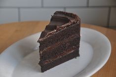 a slice of chocolate cake on a white plate