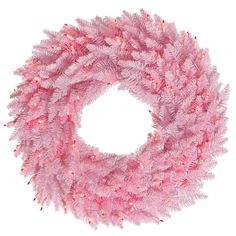 a pink christmas wreath with red lights on the top and bottom corner, in front of a white background