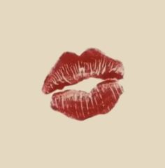 a red lip is shown on a beige background