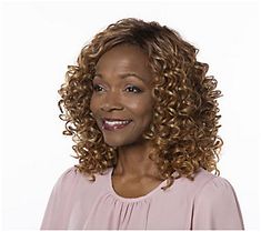 Get noticed in the Toni Brattin Irresistible wig. The shoulder-length layered silhouette boasts stunning allover spiral curls to create natural-looking texture, bounce, and movement. Style curls in smooth spirals or fluffed up for a sassier look.  A specially designed wig cap can be easily adjusted for a custom fit. Additional comfort features include a wide velvet band at the front hairline, open wefting on top, and adjustable sizing tabs in the neckline for a comfortable and secure fit. All To Shoulder Length Layered, Curly Crochet Hair Styles, Red To Blonde, Spiral Curls, Curl Styles, Crochet Hair, Crochet Hair Styles, Wig Cap, Hair Shampoo