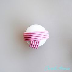 a cupcake with pink icing on top of it