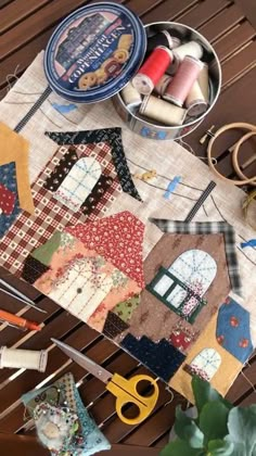 sewing supplies and scissors on a wooden table