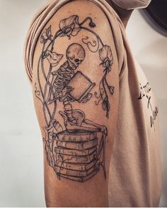 a skeleton sitting on top of a stack of books and holding a book in its hands