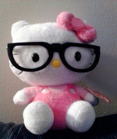 a hello kitty stuffed animal wearing glasses