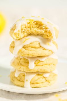 a stack of lemon cookies with icing on a plate