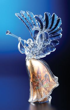 a glass figurine with an ornate design on it