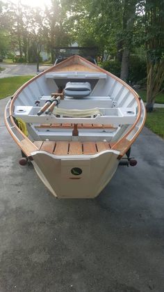 a small boat is parked in the driveway