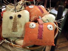 a basket filled with lots of pillows on top of a table