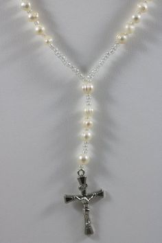 Thank you for looking at this listing!Up for sale is:Silver Tone 6mm Ringed Baroque Pearl Bead Y Necklace Cross Crucifix Catholic Christian Jesus PendantUsed, please see pictures for details on condition.I'm not an expert in rating condition, so please look carefully at the pictures and ask questions.What you see is what you get, sold As-Is.Shipping only within the United States. If you win multiple listings, I can combine shipping costs as long as items are paid for within 5 days of the first l Elegant Pearl Rosary With 8mm Beads, Elegant Beaded Rosary For Jewelry Making, Elegant Pearl White Rosary With Round Beads, Elegant Pearl Rosary With Round Beads, Elegant Pearl Beaded Rosary, Elegant Beaded Rosary With Round Beads, Adjustable Elegant Rosary, Elegant Adjustable Rosary, Elegant Beaded Rosary