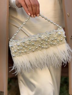 "Fancy slim wedding clutch is handmade and decorated with lace, pearl beads, and ostrich feathers embellishment on the front. The glamorous and vintage-looking small bridal handbag will be a great addition to your amazing look on the Special Day! The tiny elegant evening bag has a fold-over cover with sewn manually pearls, sequins, clear crystals, and ostrich feathers. The luxury handbag closes with a magnetic clasp. It will be a great accessory addition to the bride's outfit. The delicate women Elegant Cheap Evening Bag For Events, Affordable Glamorous Wedding Shoulder Bag, Luxury Cream Bags For Formal Occasions, Luxury Elegant Satchel For Formal Occasions, Luxury Party Bags With Fold Over Clasp, Luxury Chic Satchel For Party, Luxury Glamorous Evening Bag With Bling, Trendy Luxury Evening Flap Bag, Luxury Pearl Embellished Evening Bag