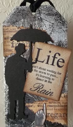 altered photograph of a person holding an umbrella with the words life written on it in black and white