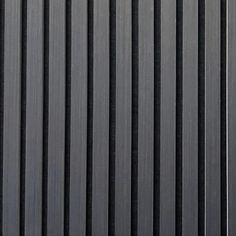 a black and silver wall with vertical lines on it