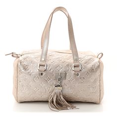 This is an authentic LOUIS VUITTON Monogram Shimmer Comete in Peach. This chic tote is crafted of Louis Vuitton metallic embossed light pink shimmery leather. The bag features leather straps with polished silver links and a decorative frontal silver plate from which is suspended a silver tipped leather tassel. The top zipper opens to a gray fabric interior with a patch pocket. Monogrammed Duffle Bag, Louis Vuitton Empreinte, Louis Vuitton Vernis, Mini Moon, Louis Vuitton Damier Azur, S Monogram, Gray Fabric, Wallet Chain, Leather Tassel