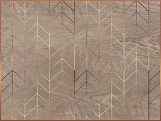 an art deco style rug with gold and brown geometric design on the front, along with a wooden background