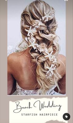 the back of a woman's head with long hair and flowers in her hair