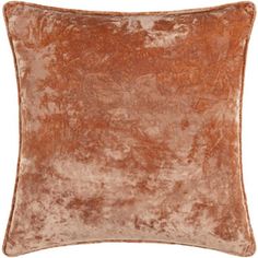 a brown velvet pillow on a white background