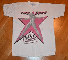 1980's THE CURE tee shirt  Size: Medium Brand: Unknown Material: 100% cotton  Chest: 20 inches  (measured across the shirt from armpit to armpit) Length: 26.5 inches  (measured from top to bottom starting at the back collar) Condition: EXCELLENT vintage condition w/ no holes but has some light storage marks that may wash out  **Any reasonable offers will be considered** DOMESTIC SHIPPING   $0.00  FREE INTERNATIONAL SHIPPING  $20.00 Canada $25.00 Rest of the World I have an enormous vintage tee shirt collection, so if you are looking for any specific feel free to toss me an email.. Enjoy!! Vintage T Shirt Aesthetic, Vintage Band Tshirt, Vintage Summer Shirt, Vintage T Shirts 70s, Lana Del Rey Tshirt, Rock Tshirts, 80s Band Tees, Vintage Graphic T Shirt, 80s Tshirts