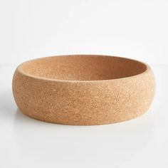 an empty bowl sitting on top of a white table