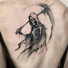 a man's back with a skeleton holding a sculler tattoo on it