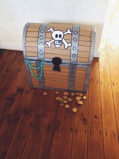 a pirate chest with coins on the floor