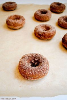 doughnuts sitting on top of a baking sheet