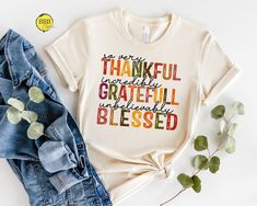 So Very Thankful Shirt, Thankful Grateful Blessed Shirt, Thanksgiving Shirt, Thankful Fall Shirt, Thanksgiving Gift For Her, Grateful Shirt - NOTE  We will use Black design for White, Athletic Heather, Pink, Natural, Mint and Heather Peach. White design for all other colors. Dear Customer, We're here to give you best Thanksgiving shirt options for you. We want to make everyone smile with our cute , stylish and trendy graphic T-shirts. We can assure you this shirt will be perfect Thanksgiving gift whether you will buy it yourself or for someone else. 1. Important Check size chart before you purchase 2. How to Order * Pick your shirt type and size Your design will be printed on the front.  *Pick your t-shirt color **note; tote bag is available in natural color only** 3.Production  Processing Greeting Card Phrases, Thankful Grateful Blessed Shirt, Grateful Shirt, Fall Embroidery Designs, Blessed Shirt, Thankful Shirt, Thankful Grateful Blessed, Perfect Thanksgiving, Thankful And Blessed