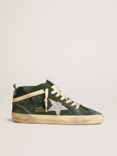 Uniquely elegant versatility: the Mid Star sneakers take a refined approach to their Nineties skate scene inspiration. This model with a forest green suede upper features a silver metallic leather star and a cream-colored leather flash with silver metallic leather trim. The forest green suede heel tab and cream-colored laces complete the look. Scene Inspiration, Golden Goose Sneakers, Lace Jewelry, Glitter Stars, Star Sneakers, Green Suede, Colored Leather, Golden Goose, Metallic Leather