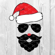 a santa hat, sunglasses and beard on a wooden background