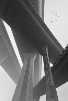 black and white photograph of the underside of a bridge