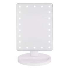 a white lighted vanity mirror on top of a table