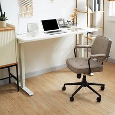 an office chair sitting in front of a desk with a laptop on it