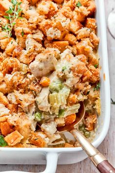 a casserole dish with chicken and vegetables in it, ready to be eaten