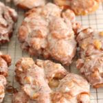 there are many donuts on the cooling rack