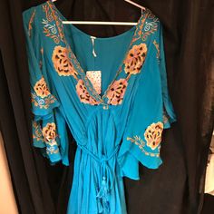 Turquoise Free People Dress New With Tags!! Size Small! Never Worn! Flared Arms With A Tie Around The Waist! Super Cute! Turquoise V-neck Maxi Dress For Vacation, Turquoise Maxi Dress For Beach Cover-up In Spring, Spring Turquoise Maxi Dress For Beach Cover-up, Turquoise Maxi Dress For Spring Beach Cover-up, Turquoise V-neck Mini Dress For Vacation, Blue Rayon Dress For Brunch, Turquoise V-neck Mini Dress For Summer, Turquoise Flowy Maxi Dress For Beach Cover-up, Turquoise V-neck Summer Dress